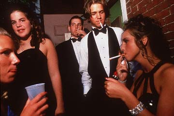 Photograph published with a Boston magazine story: five teenagers dressed for a formal event, some holding drinks and smoking.